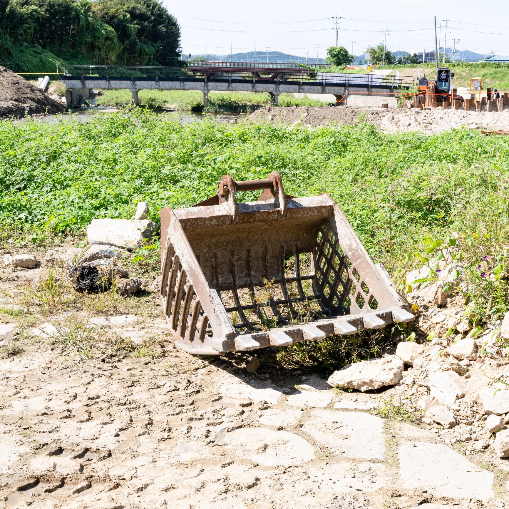 Close-up of an excavator bucket on a construction site
