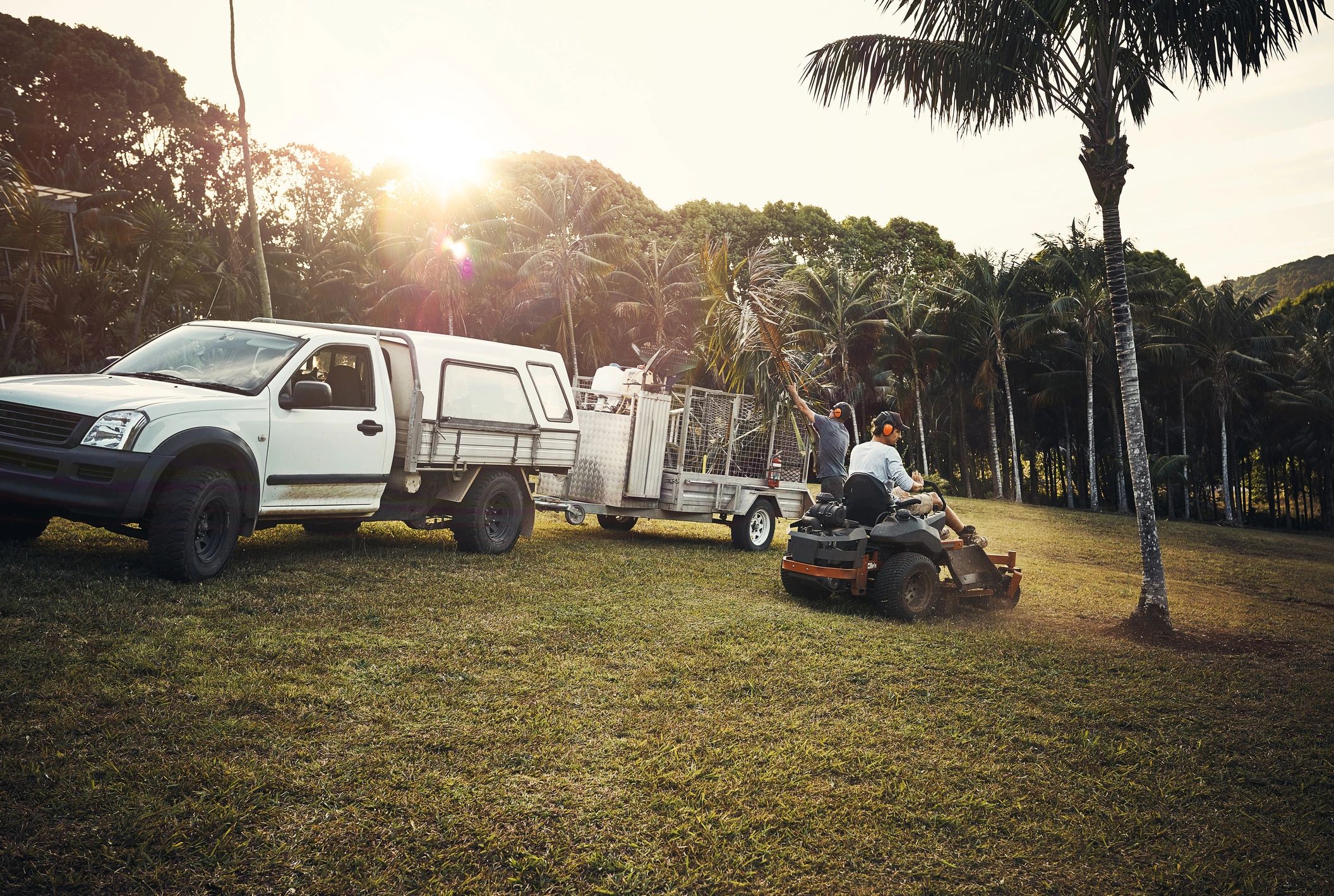 Two landscapers working in a park